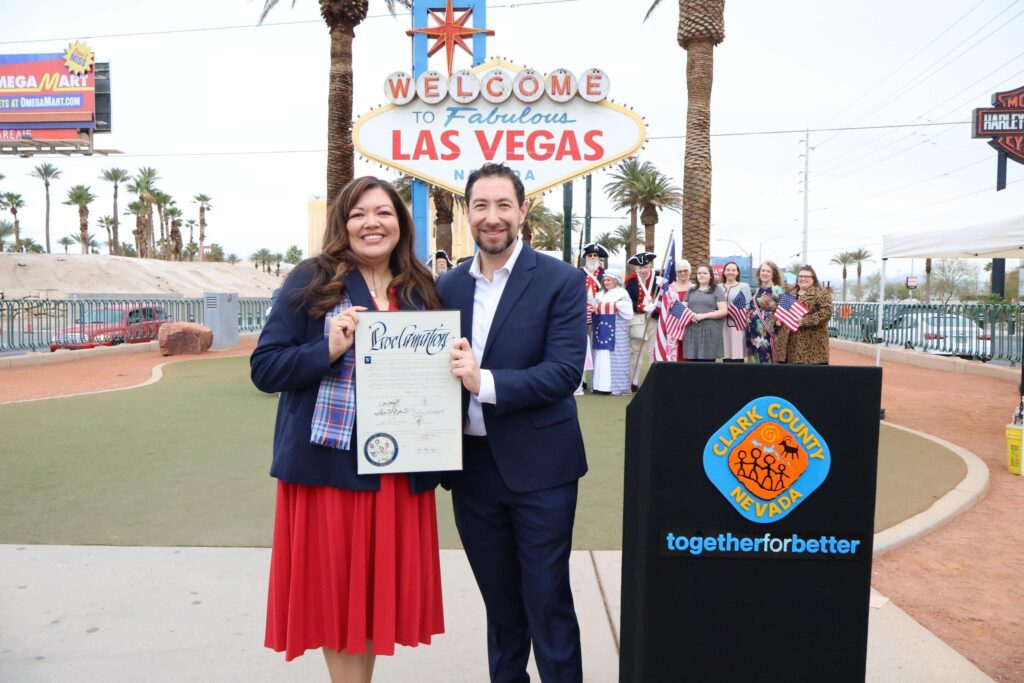 Clark County Commission Chairman Michael Naft poses at the Welcome to Fabulous Las Vegas sign during the America250 kickoff ceremony.