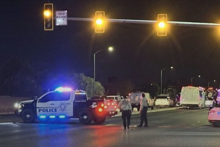 A Las Vegas police officer was shot at a southwest valley home before SWAT officers found a male suspect and female juvenile dead, LVMPD says