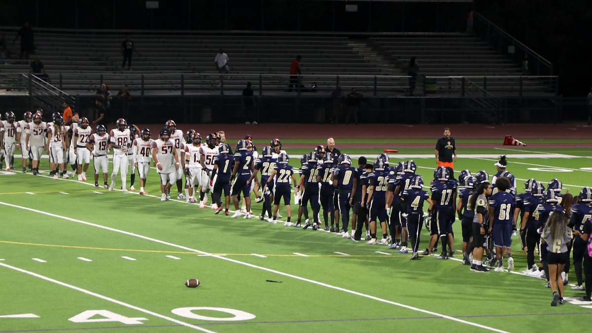 Cheyenne and Chaparral players meeting for postgame handshakes after Cheyenne's 26-24 victory